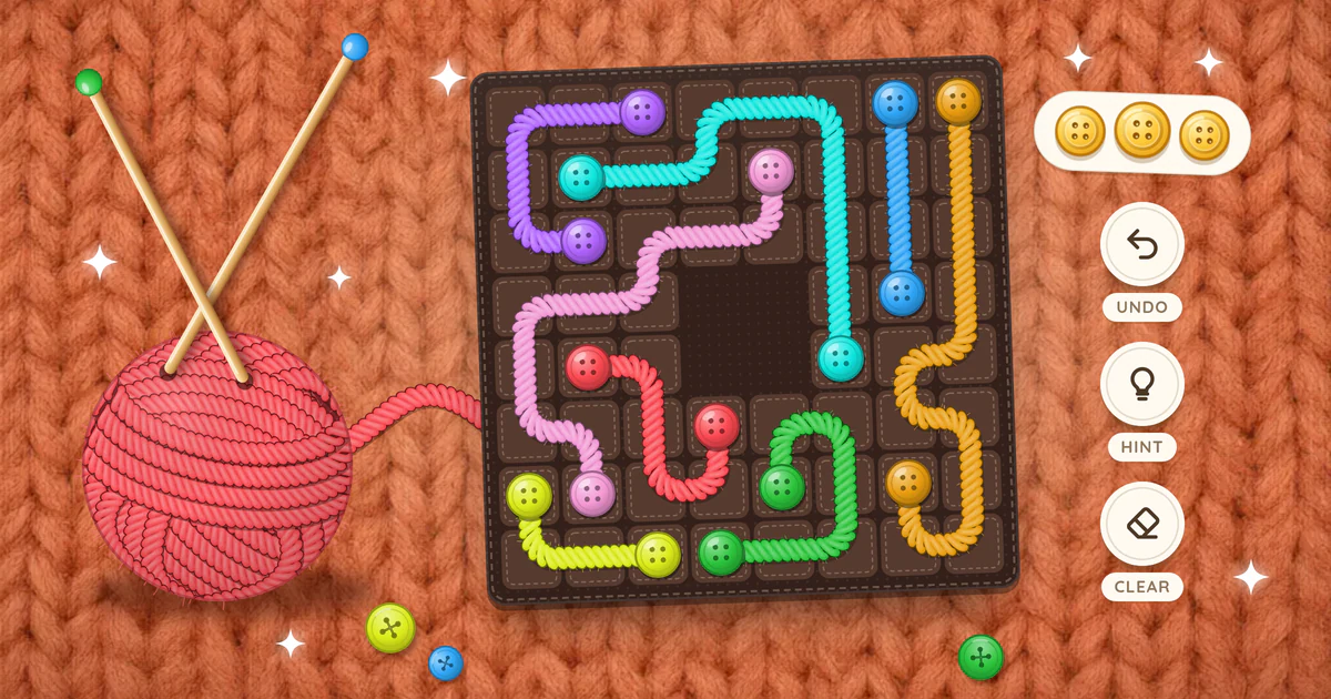 A Yarn Link board on warm orange wool knit, with colorful threads of yarn joining pairs of buttons, a ball of red yarn, undo, hint and clear buttons and three gold buttons